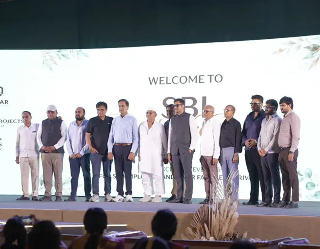The Pramukh and Omkar teams on stage at a Rivanta welcome event